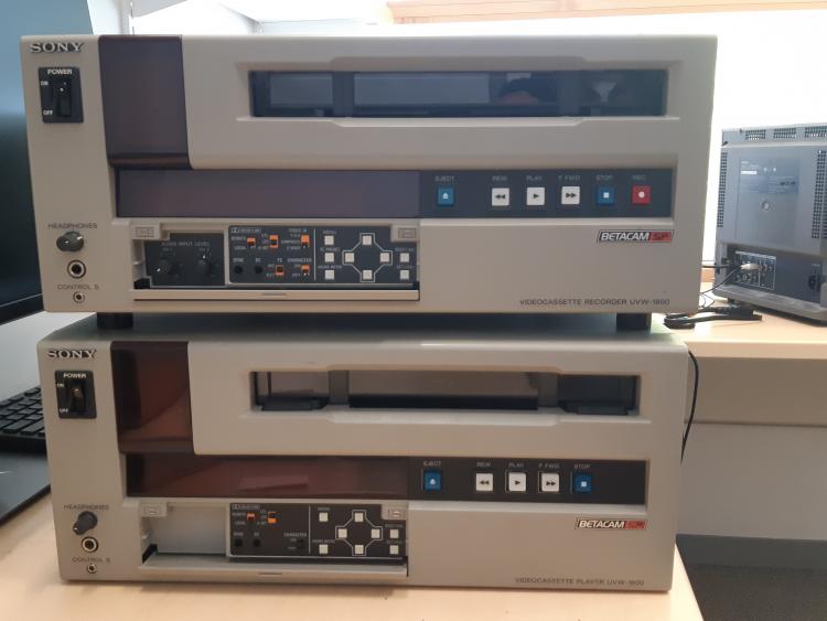 Two commercial Beta video machines stacked on top of one another. 